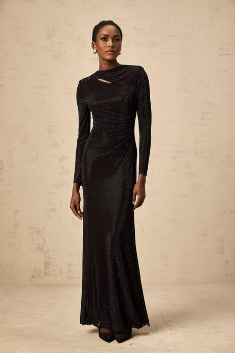 A long black maxi dress with ruched mesh fabric and rhinestone embellishments