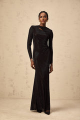 A long black maxi dress with ruched mesh fabric and rhinestone embellishments