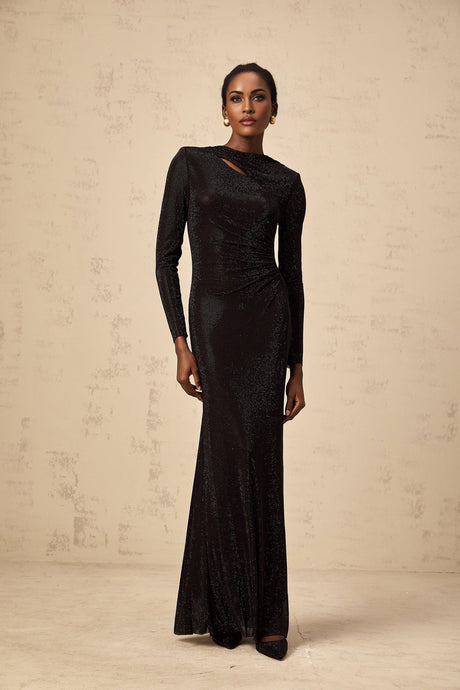 A long black maxi dress with ruched mesh fabric and rhinestone embellishments