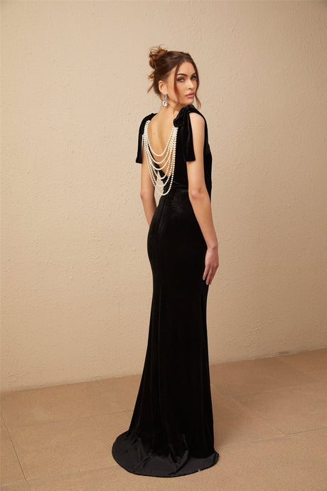 A long black velvet maxi dress with an open back and embellished details named Audrey