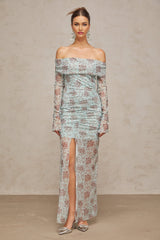 A long blue maxi dress with a floral print pattern and ruched detailing