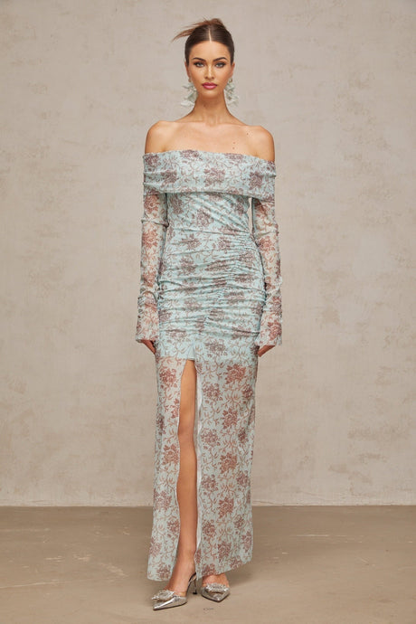 A long blue maxi dress with a floral print pattern and ruched detailing
