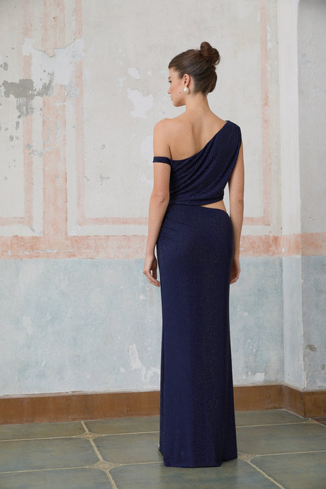 A long blue maxi dress with cut out details and rhinestone embellishments