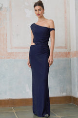 A long blue maxi dress with cutout details and rhinestone embellishments worn by a model