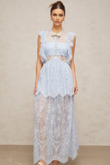 A long blue maxi dress with layered lace details and a feminine silhouette named Capucine