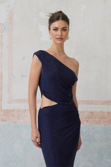 A long blue maxi dress with rhinestone embellishments and cut out details worn by a model
