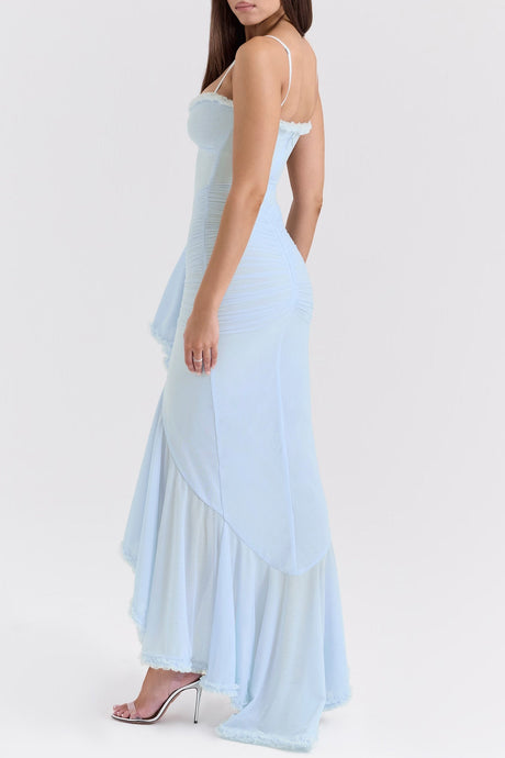 A long blue maxi dress with ruffle details and draped fabric featuring a flowing silhouette and feminine design