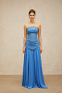A long blue pleated maxi dress with faux pearl embellishments by Gaelle