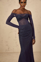 A long dark blue maxi dress with a corset bodice featuring embellishments and sheer tulle panels