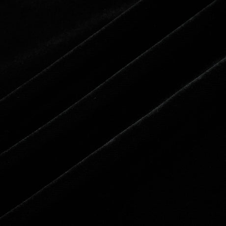 A long dark velvet dress with an open back and embellishments named Audrey shown on a model against a plain background