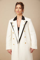 A long doublebreasted blazer made of wool featuring color blocking in shades of terebinth