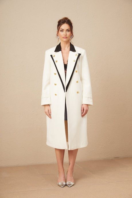 A long doublebreasted blazer made of wool featuring colorblocked design in shades of terracotta and beige with contrasting lapels and pockets