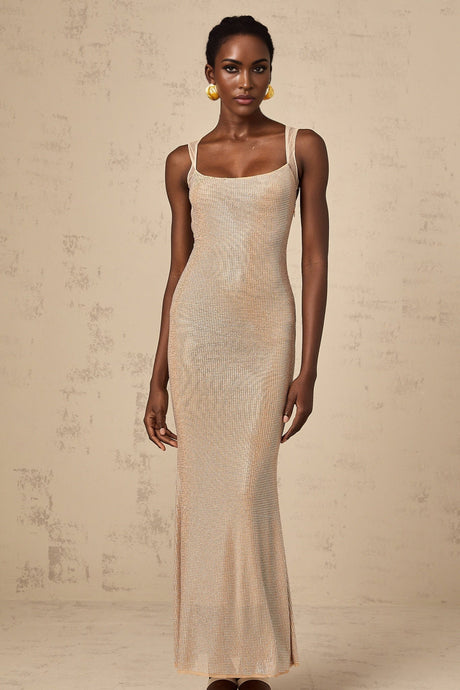 A long elegant maxi dress with crystal embellishments and an open back design