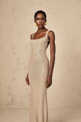 A long elegant maxi dress with crystal embellishments and an open back design
