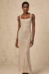 A long elegant maxi dress with crystal embellishments and an open back design