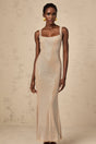 A long elegant maxi dress with crystal embellishments and an open back design