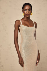 A long elegant maxi dress with crystal embellishments and an open back design