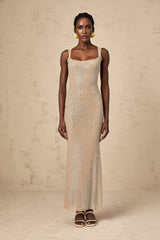 A long elegant maxi dress with crystal embellishments and an open back design