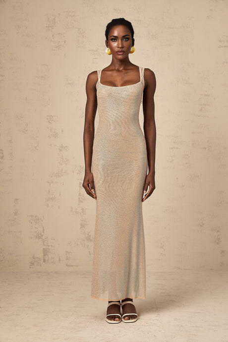 A long elegant maxi dress with crystal embellishments and an open back design