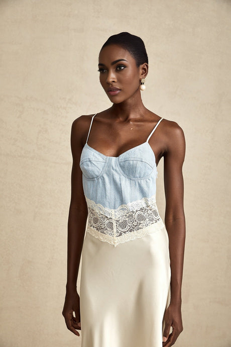 A long elegant maxi dress with lace trim and panels featuring a feminine silhouette in a flowing fabric