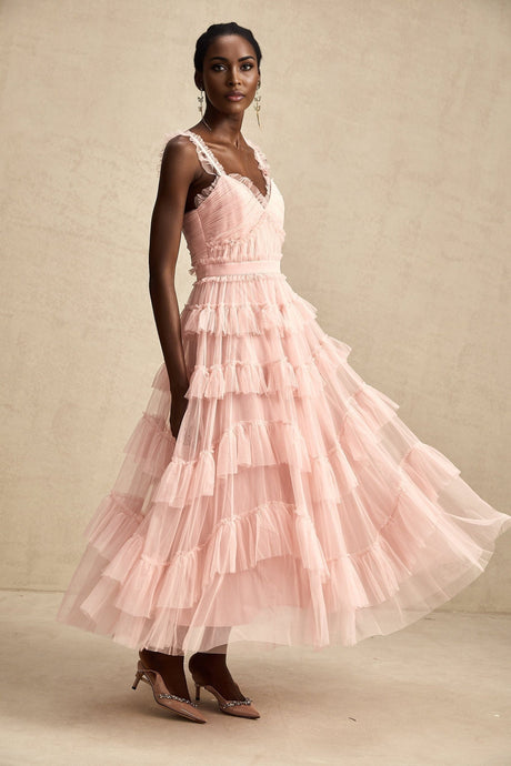 A long elegant maxi dress with layered ruffles and tulle fabric in a flowy silhouette