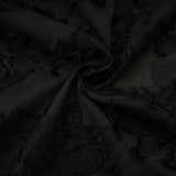 A long floral lace maxi dress in white with delicate floral patterns covering the entire garment featuring a feminine silhouette and full length skirt