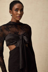 A long floral lace maxi dress with panelled design featuring a mix of sheer and opaque sections in a romantic and feminine style