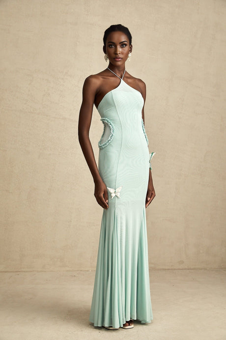 A long flowing maxi dress with butterfly pattern and ruffle details named Amelie