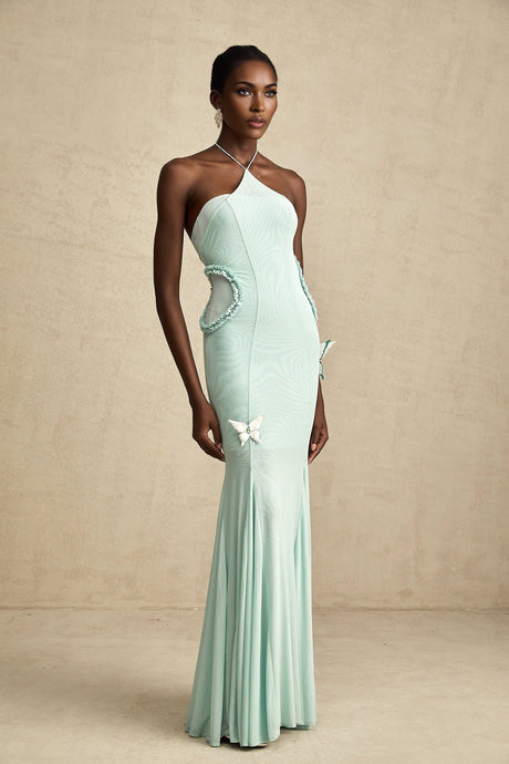 A long flowing maxi dress with butterfly pattern and ruffle details named Amelie