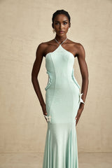 A long flowing maxi dress with ruffle details and a butterfly pattern named Amelie