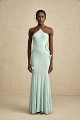 A long flowing maxi dress with ruffle details and a butterfly pattern named Amelie