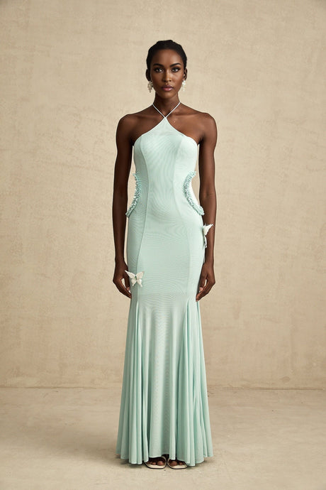 A long flowing maxi dress with ruffle details and a butterfly pattern named Amelie