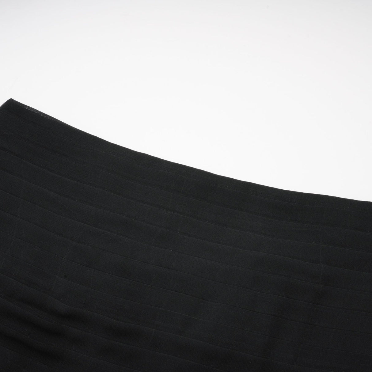 A long flowing maxi skirt with ruffles and pleats made of rayon and tulle fabric in a Jacqueline style