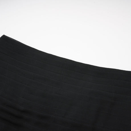 A long flowing maxi skirt with ruffles and pleats made of rayon and tulle fabric in a Jacqueline style