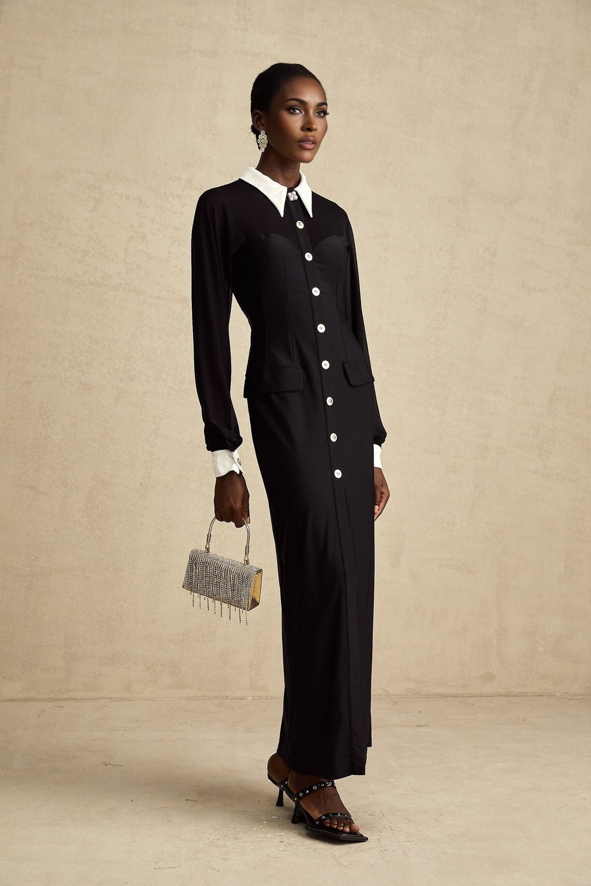A long flowy maxi dress with contrasting colors and semisheer fabric featuring a lightweight and elegant design