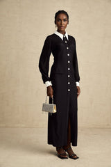 A long flowy maxi dress with contrasting colors and semisheer fabric