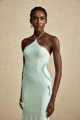 A long flowy maxi dress with ruffle details and a butterfly pattern named Amelie