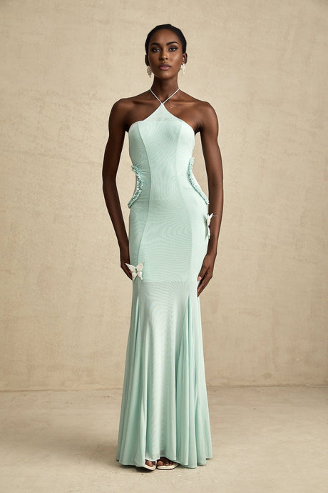 A long flowy maxi dress with ruffle details and a butterfly pattern named Amelie