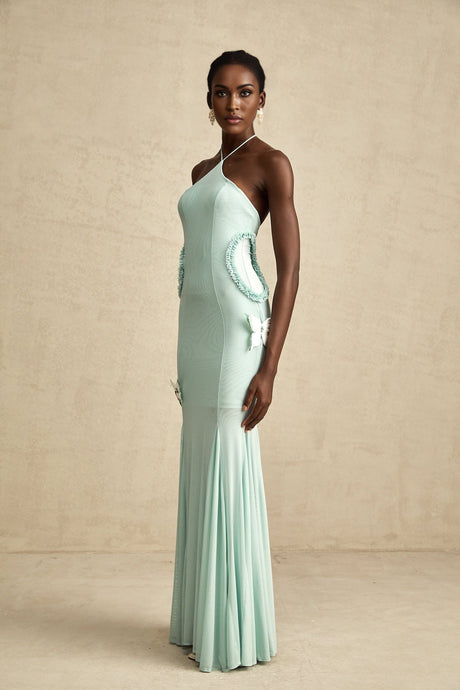 A long flowy maxi dress with ruffle details and a butterfly pattern named Amelie