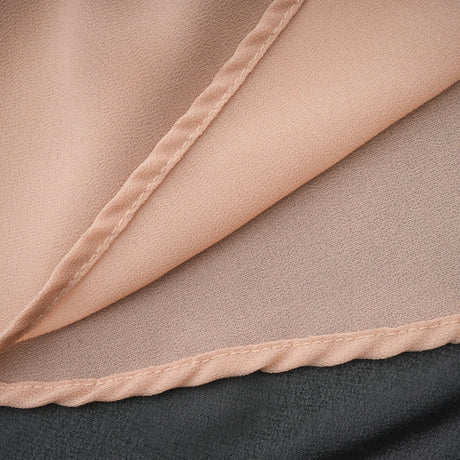 A long flowy maxi skirt with ruffle details and pleated tulle fabric in a soft rayon material