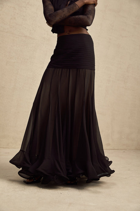 A long flowy maxi skirt with ruffles and pleats made from rayon and tulle fabric in a Jacqueline style