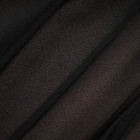 A long flowy maxi skirt with ruffles and pleats made of rayon and tulle fabric in a Jacqueline style
