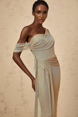 A long gold maxi dress with a gathered waist and ribbon design details