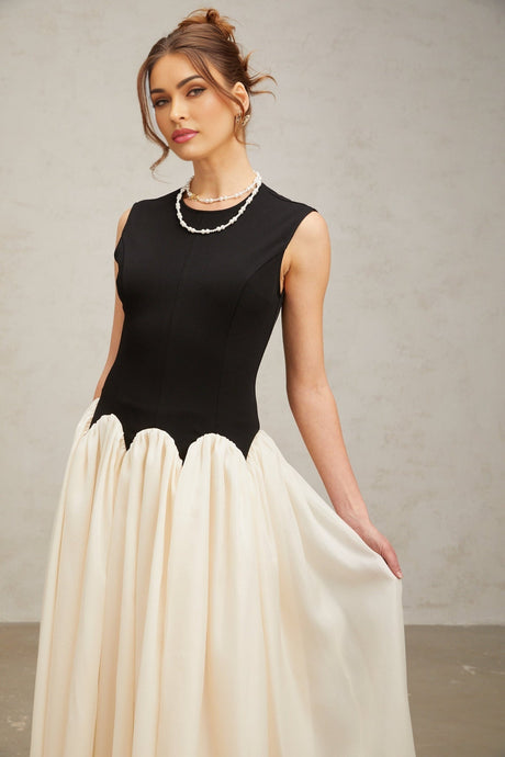 A long maxi dress with puffed sleeves featuring colorblocked sections in contrasting hues named Josette