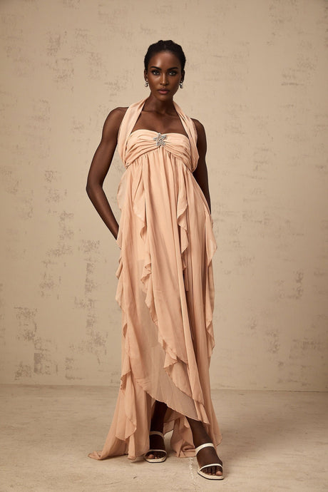 A long pink maxi dress with a halter neck and ruffled chiffon detailing