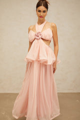 A long pink maxi dress with floral appliques and cutout details featuring a romantic and feminine design