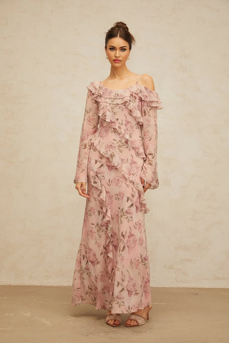 A long pink maxi dress with floral print and ruffled details