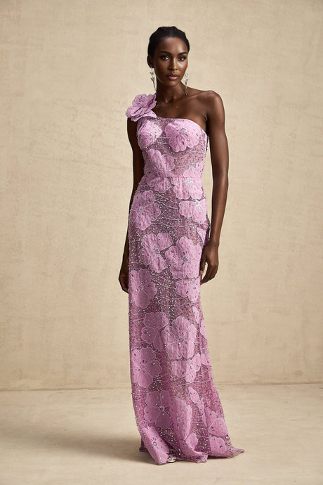A long purple maxi dress with floral applique details