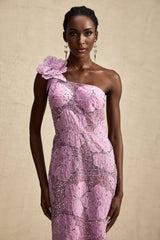A long purple maxi dress with floral applique details