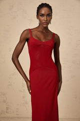 A long red maxi dress with sheer tulle panels designed by Celine